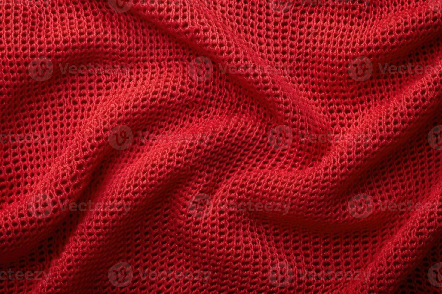 a red knitted blanket with an unlined square pattern, photo