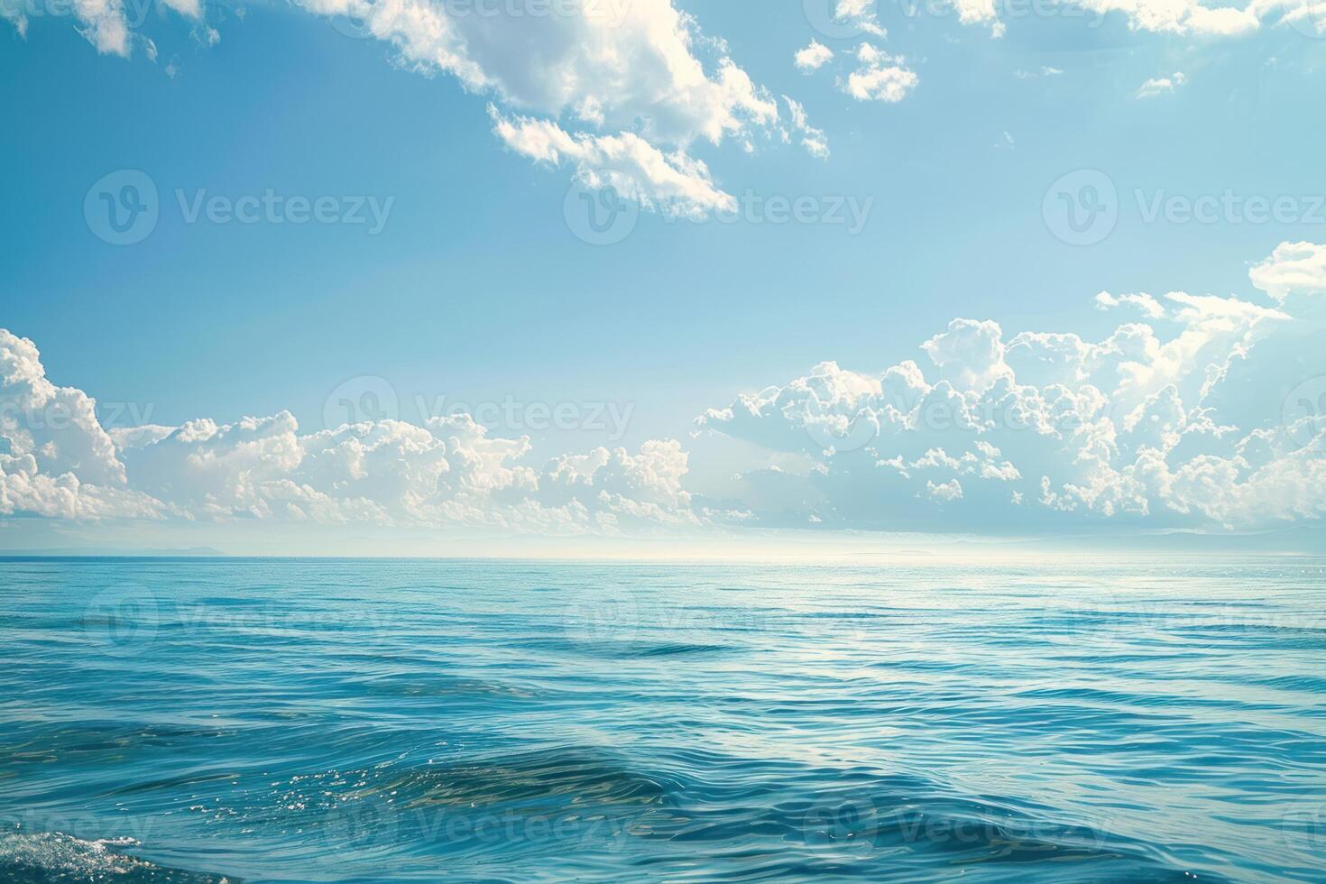 calm waves break into the sea surrounded by clouds, photo