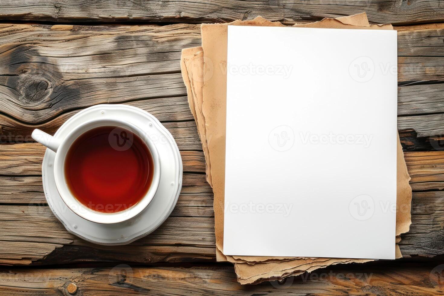 an open notepad sitting on top of a cup next to a tea, photo