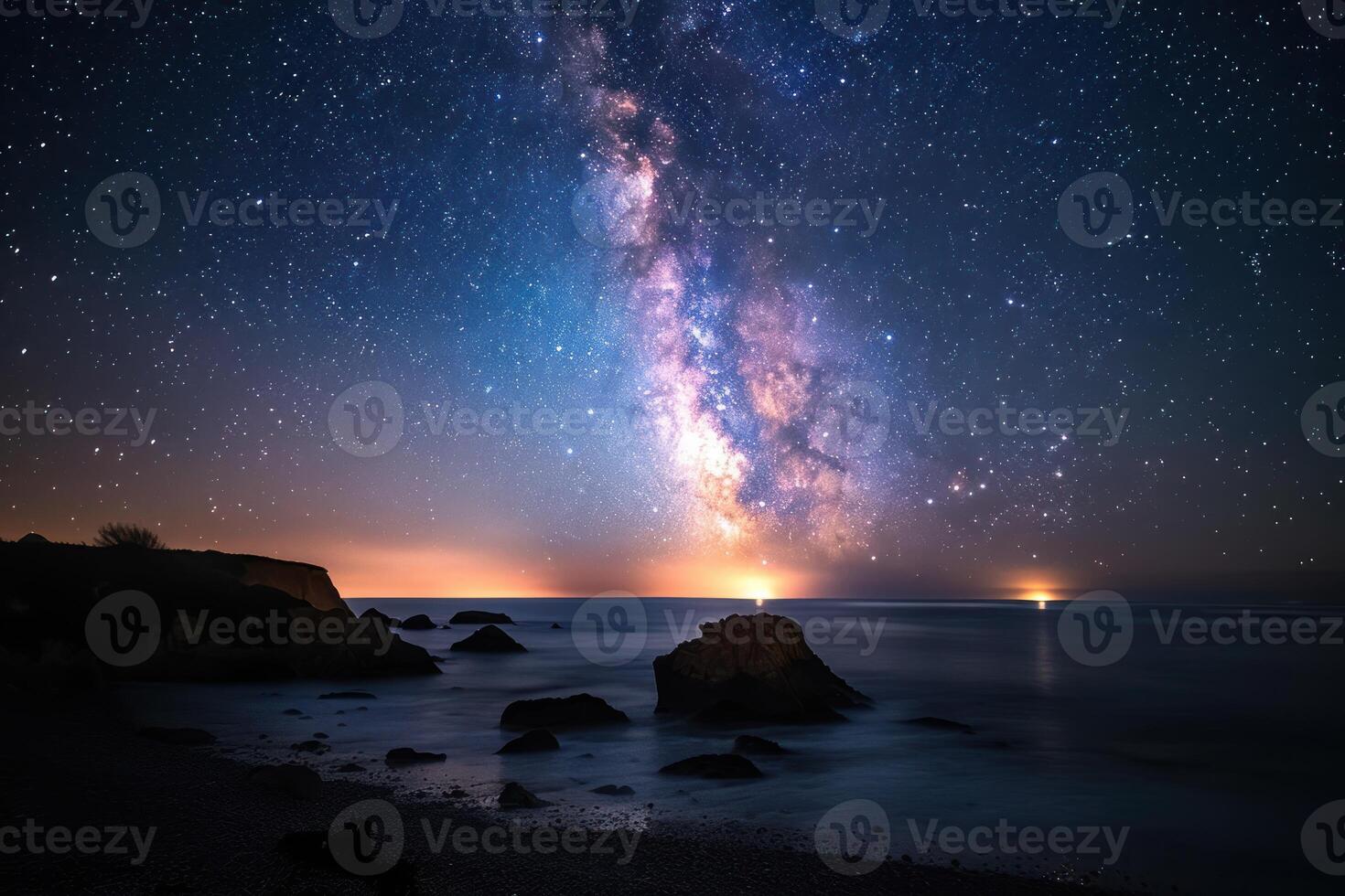a body of water sitting under a cluster of stars, photo