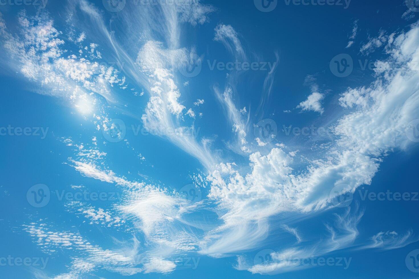 a lone cloud sits in the sky next to hills and trees, photo