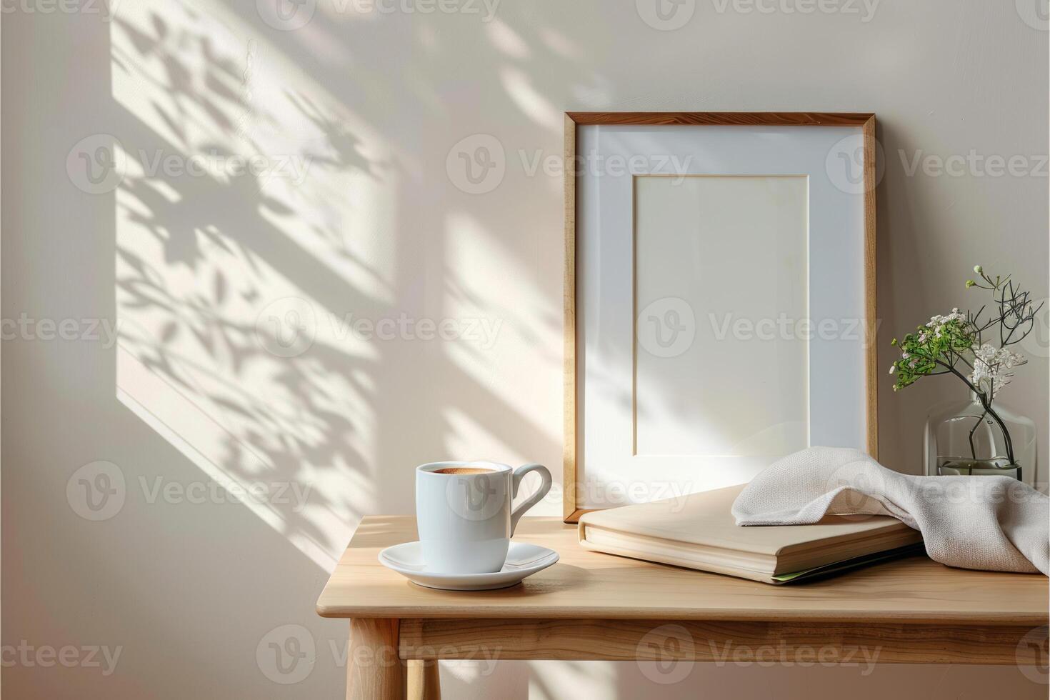a picture frame sitting on a table by the window next to flowers, photo