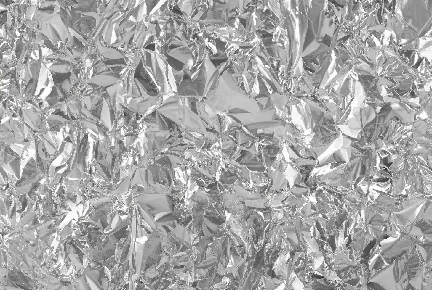 Shiny Silver Foil Leaf Texture on Grey Wrapping Paper photo