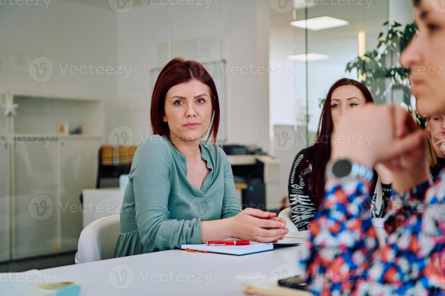 Business Team of Women Discussing New Topics and Strategies to Improve Client Operations. photo
