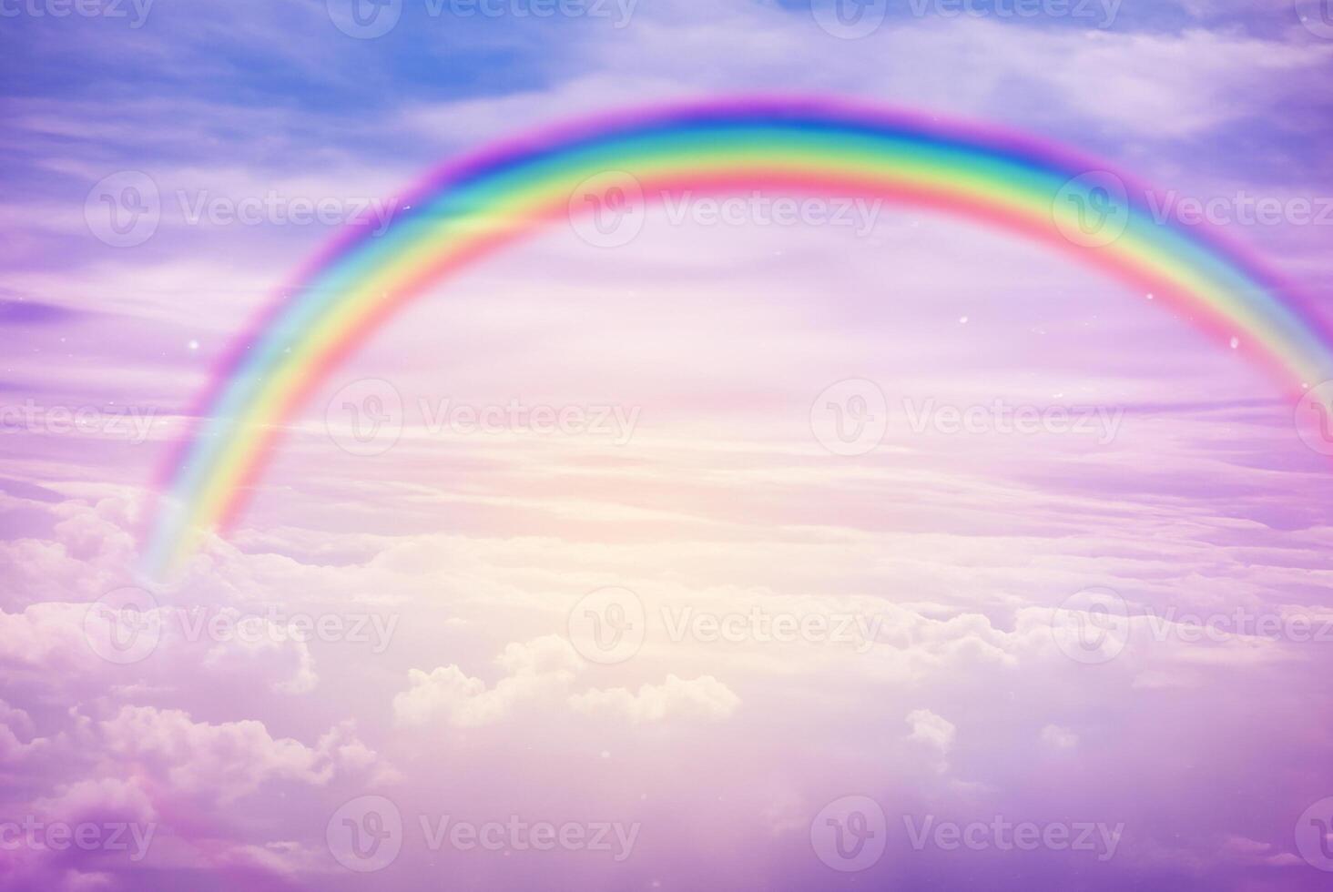 Colorful Rainbow Arching Through Cloudy Sky photo