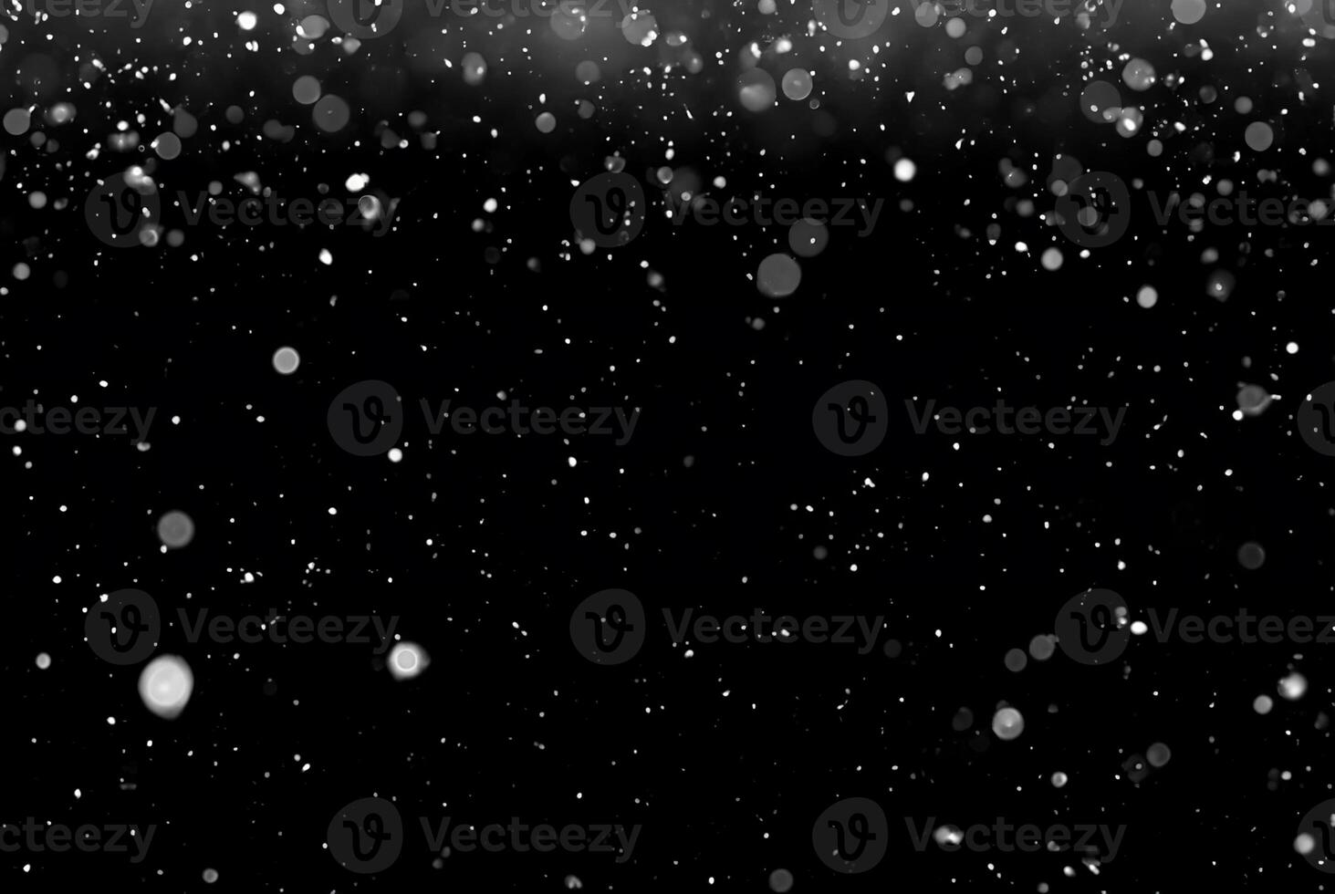 White Snow Bokeh on Black Background - Snowfall Design Element photo