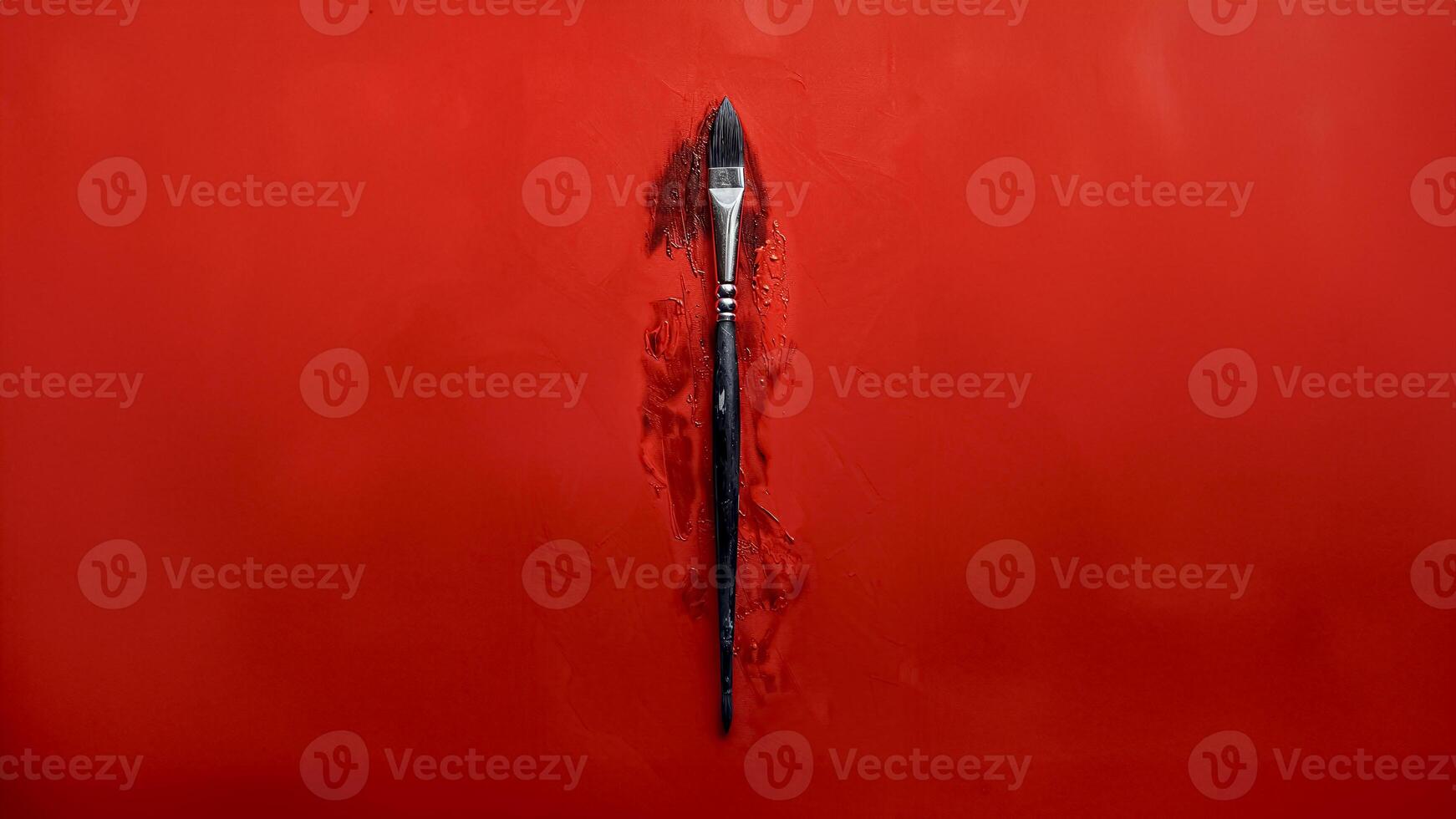 Single Paintbrush on Red Background. Artistic Expression, Creative Passion. photo