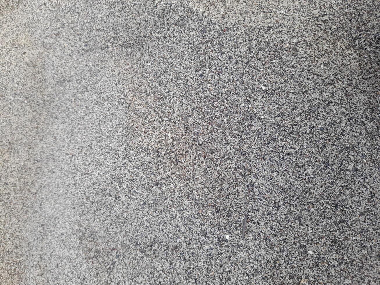 Gray beach sand background can be used for wallpaper or graphic design. photo