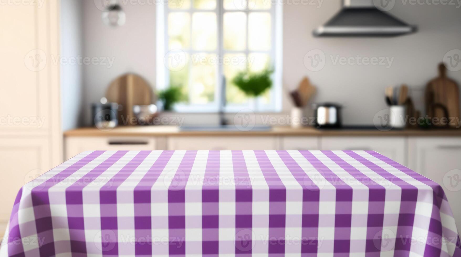 Empty table with purple and white checkered tablecloth top on blurred kitchen background photo