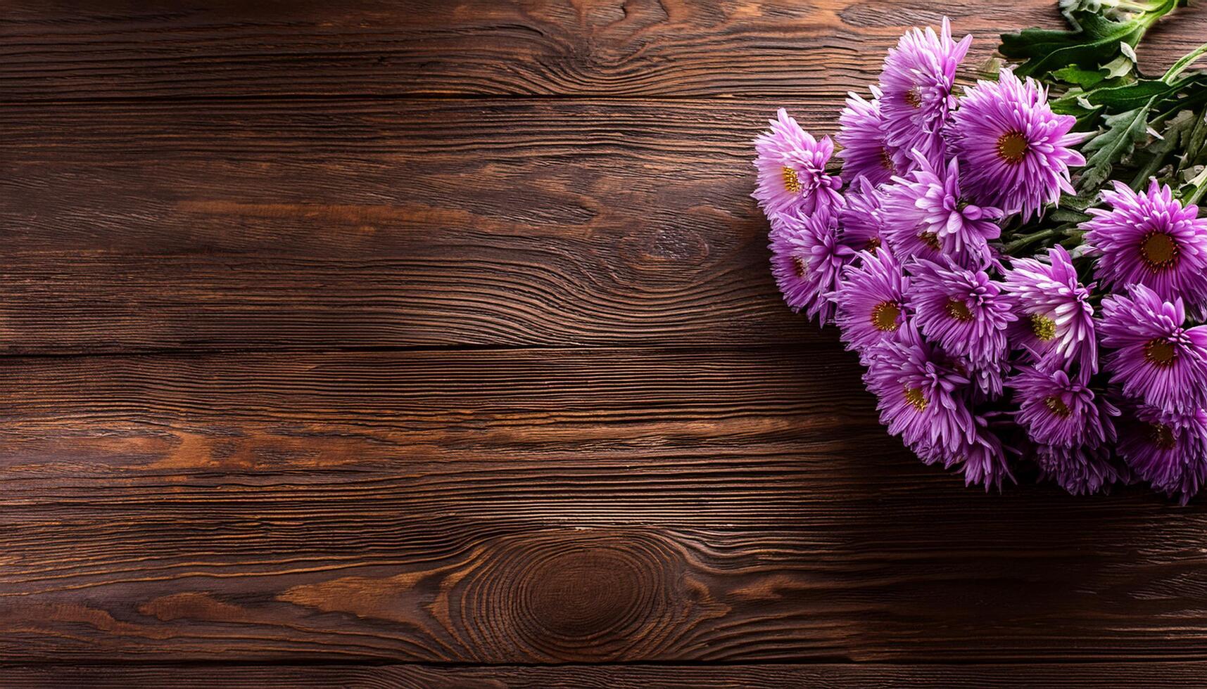 Bouquet of Purple Chrysanthemum on corner bottom right of vintage wooden table copy space, for florist or composing postcard photo