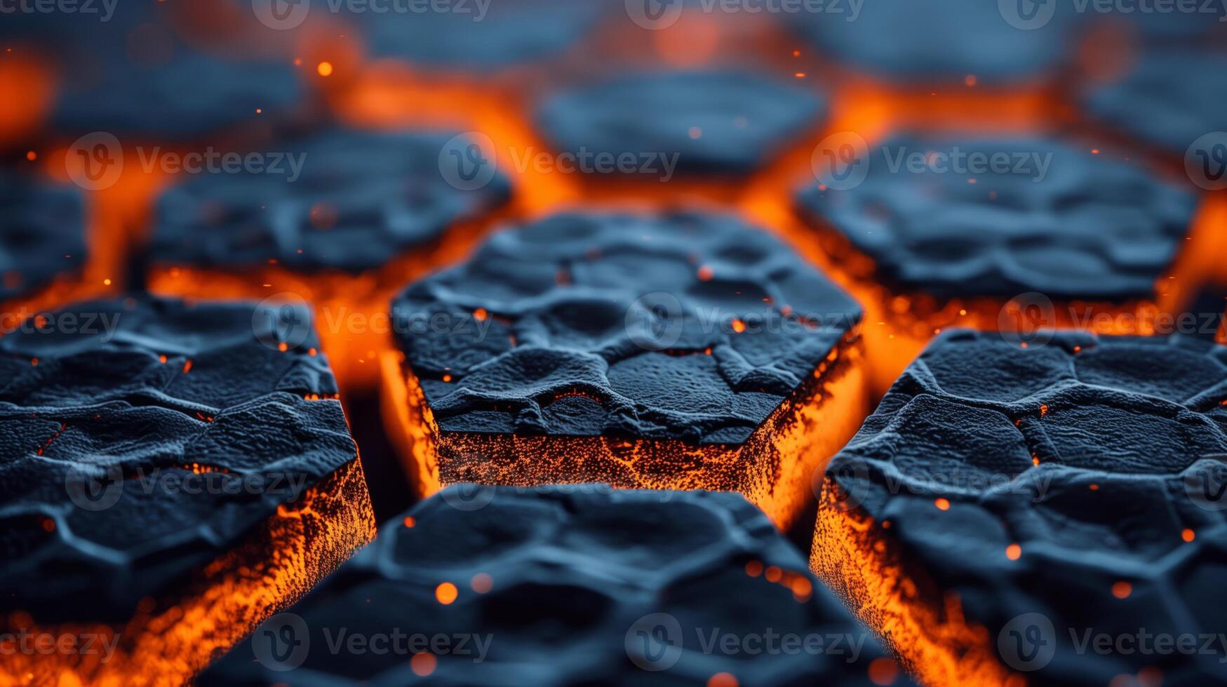 A close-up image of hexagonal shapes of molten rock with glowing orange edges. photo
