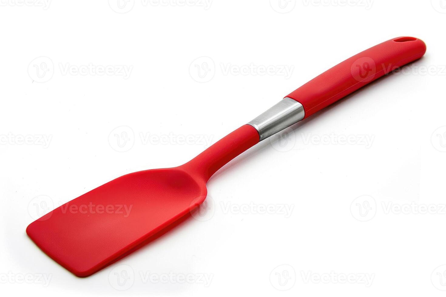 A red silicone spatula isolated on a white background. photo