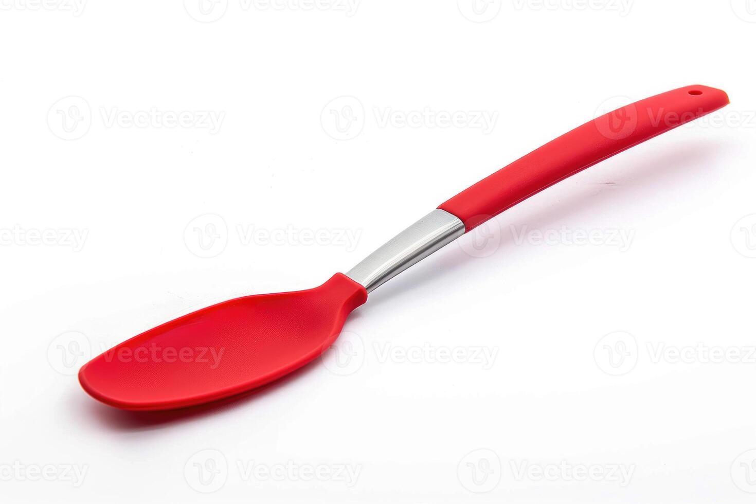 A red silicone spatula isolated on a white background. photo