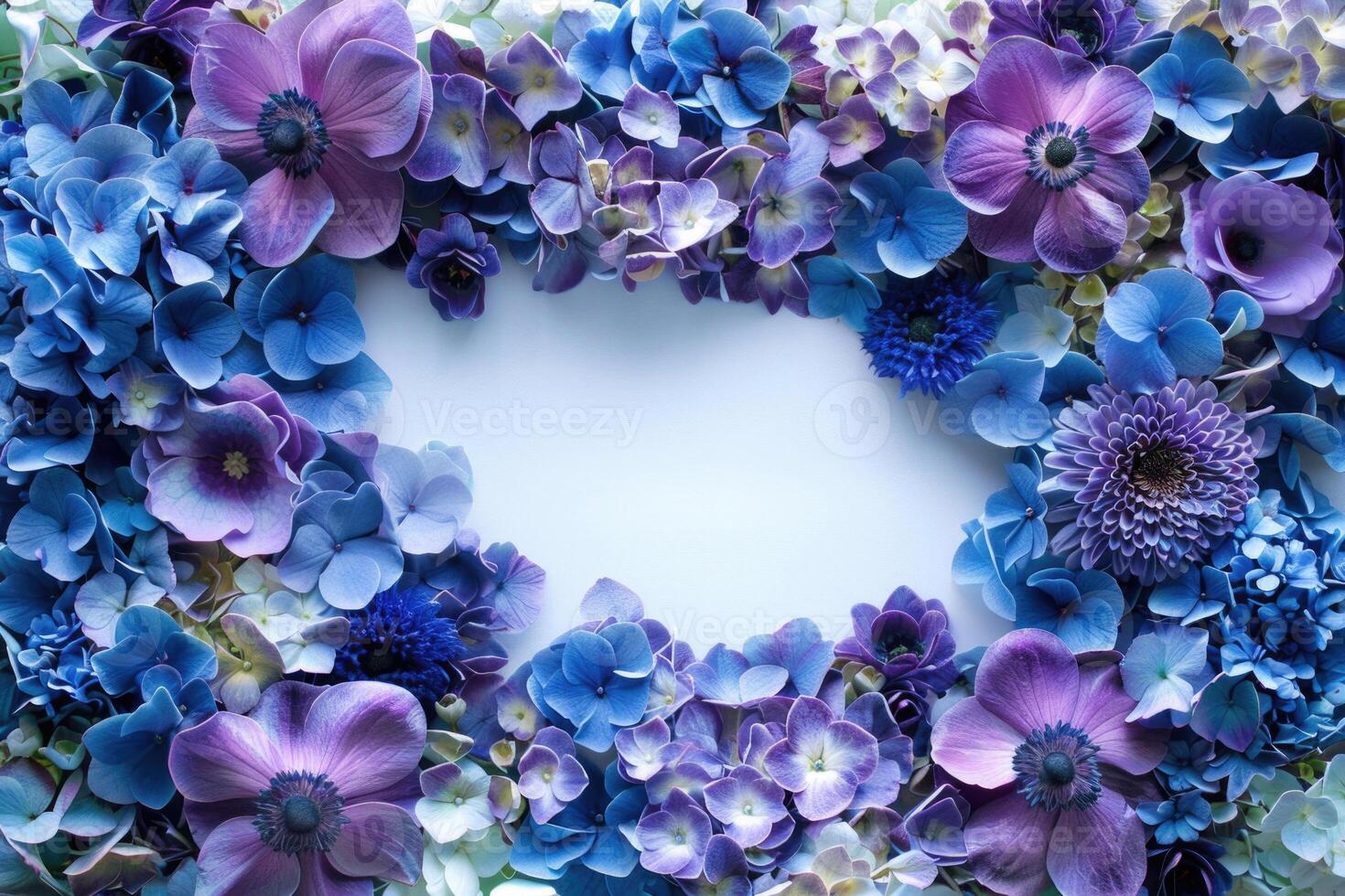 A floral banner with blue and purple flowers and a blank space for text in the center. photo
