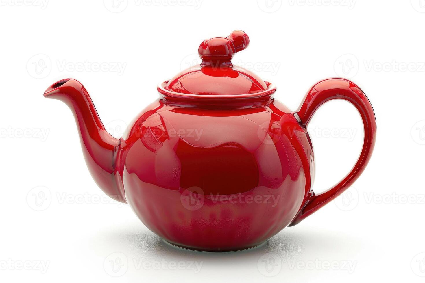 A red ceramic teapot isolated on a white background. photo