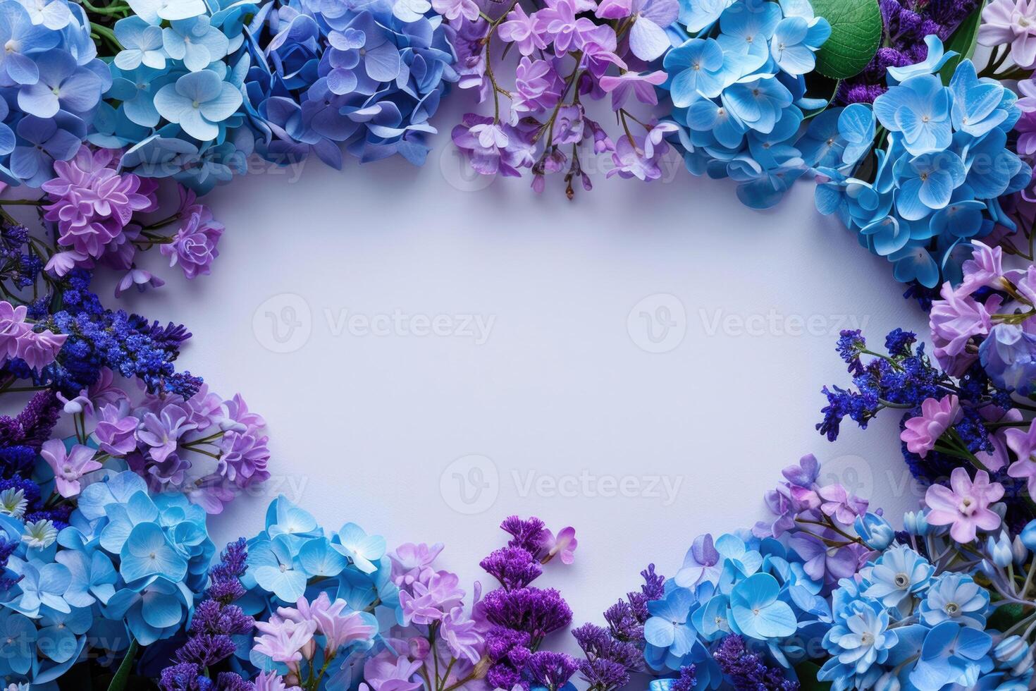 A floral banner with blue and purple flowers and a blank space for text in the center. photo