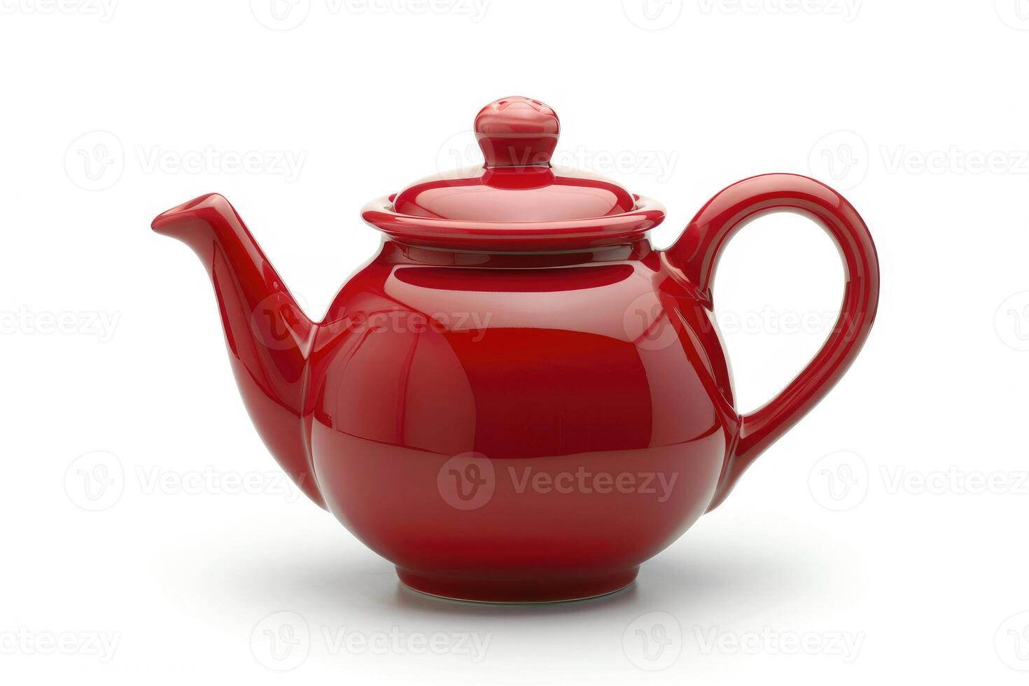 A red ceramic teapot isolated on a white background. photo