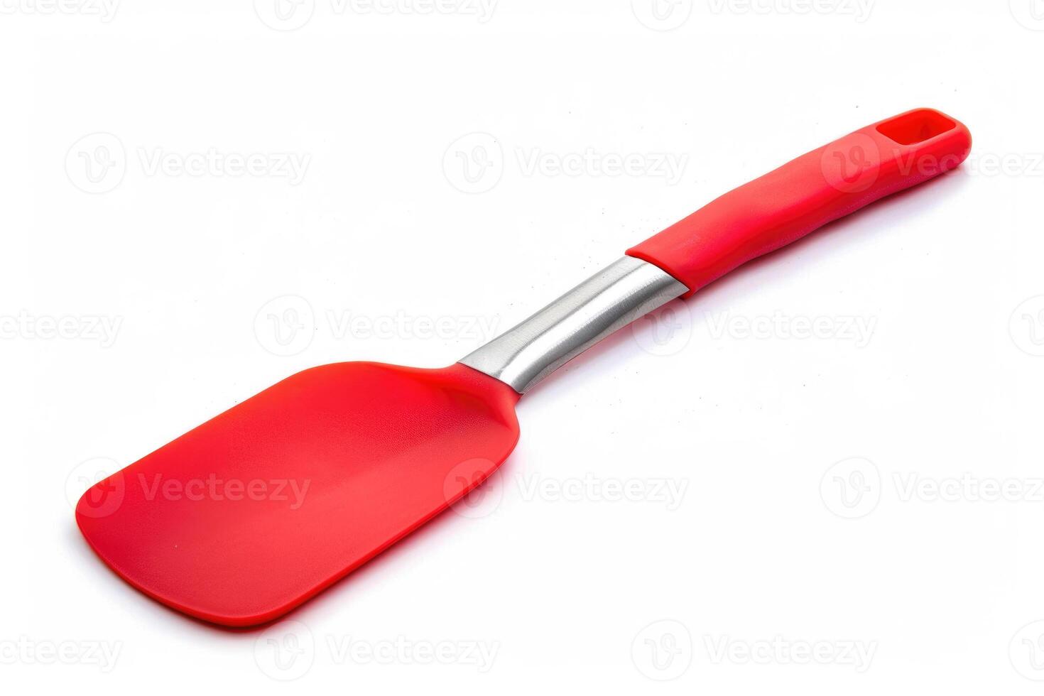 A red silicone spatula isolated on a white background. photo