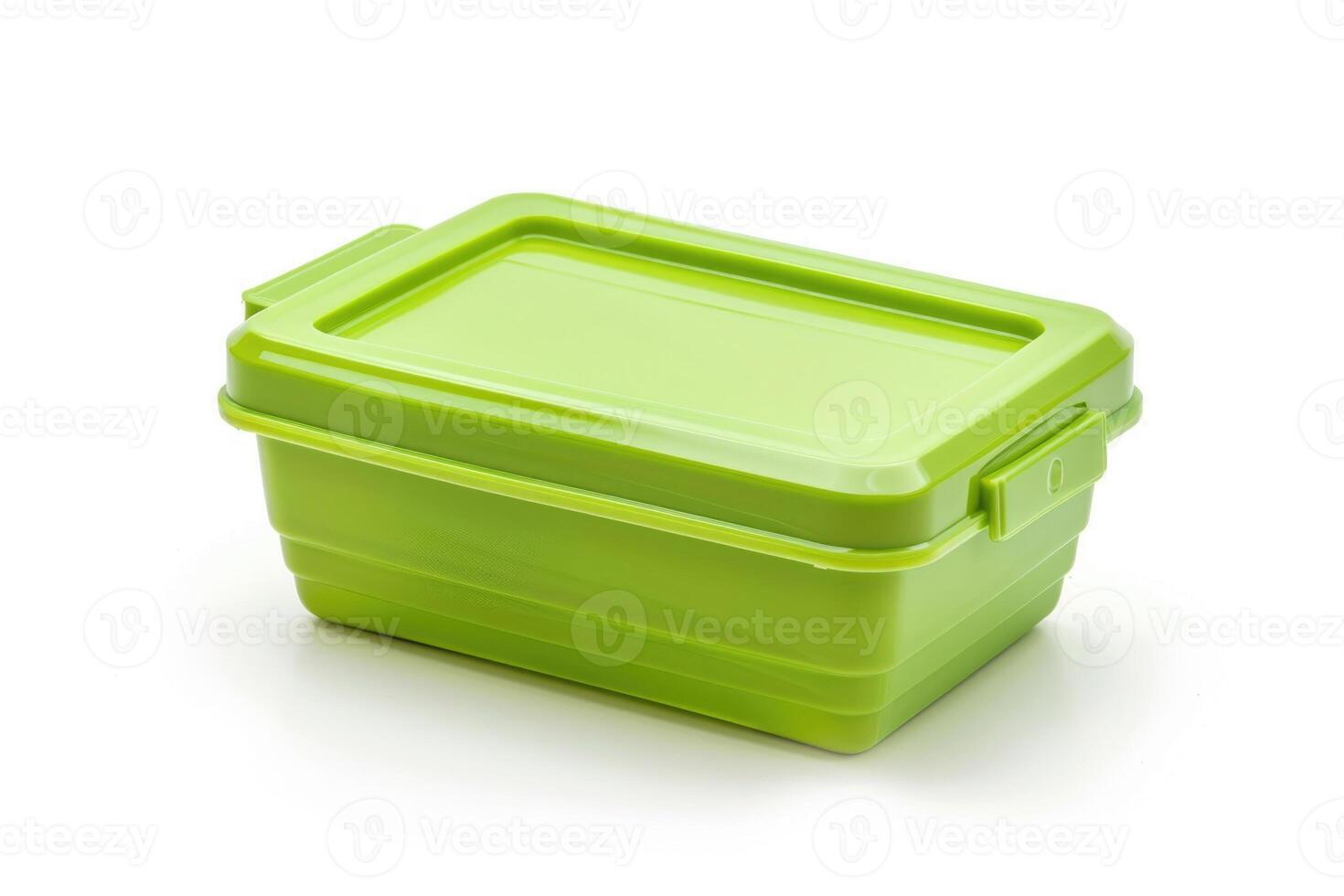 A green plastic lunch box isolated on a white background. photo