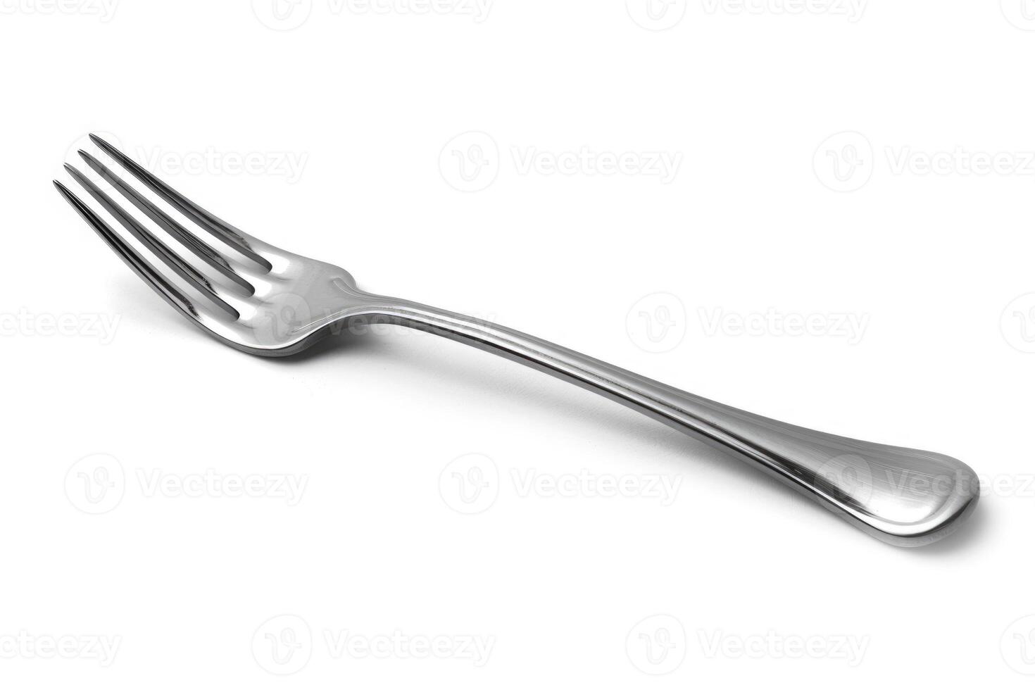 A silver stainless steel fork isolated on a white background. photo