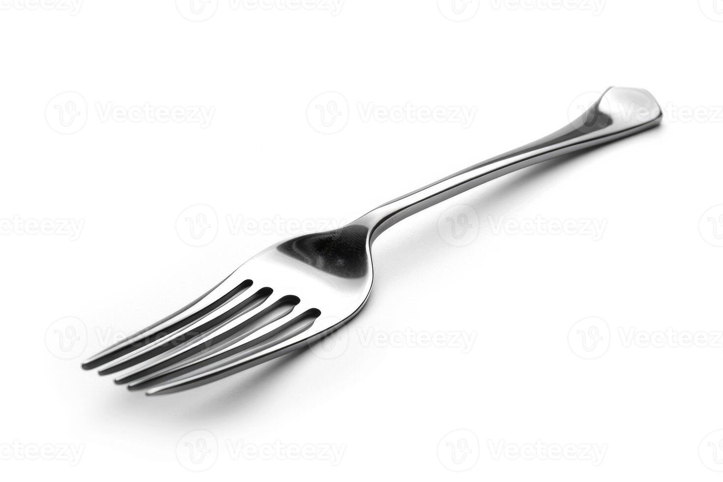 A silver stainless steel fork isolated on a white background. photo