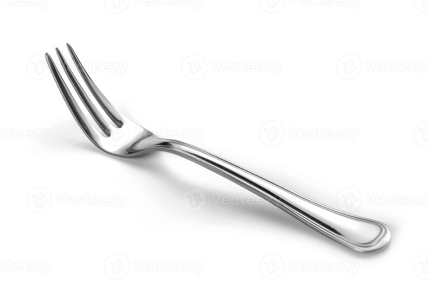 A silver stainless steel fork isolated on a white background. photo