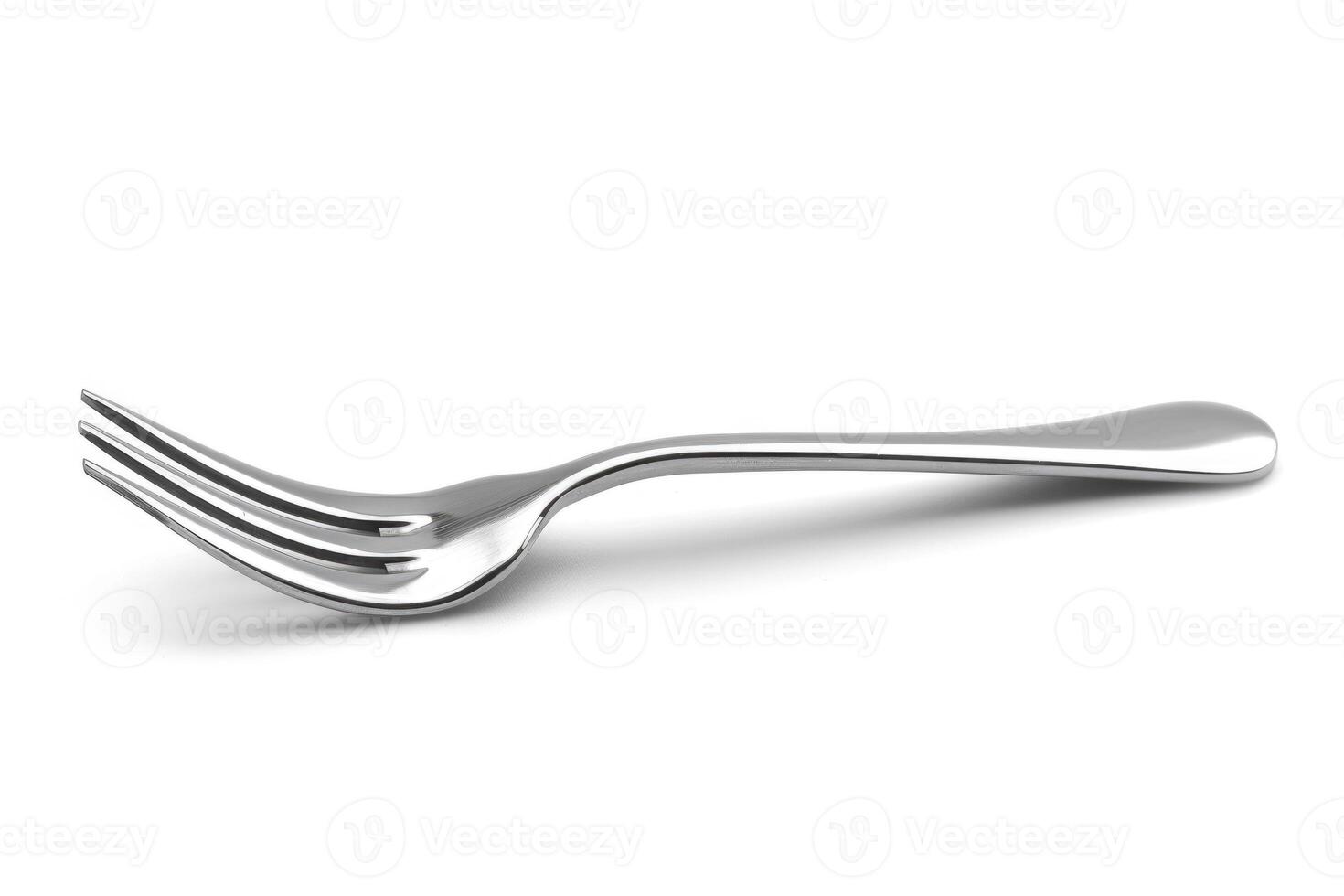 A silver stainless steel fork isolated on a white background. photo
