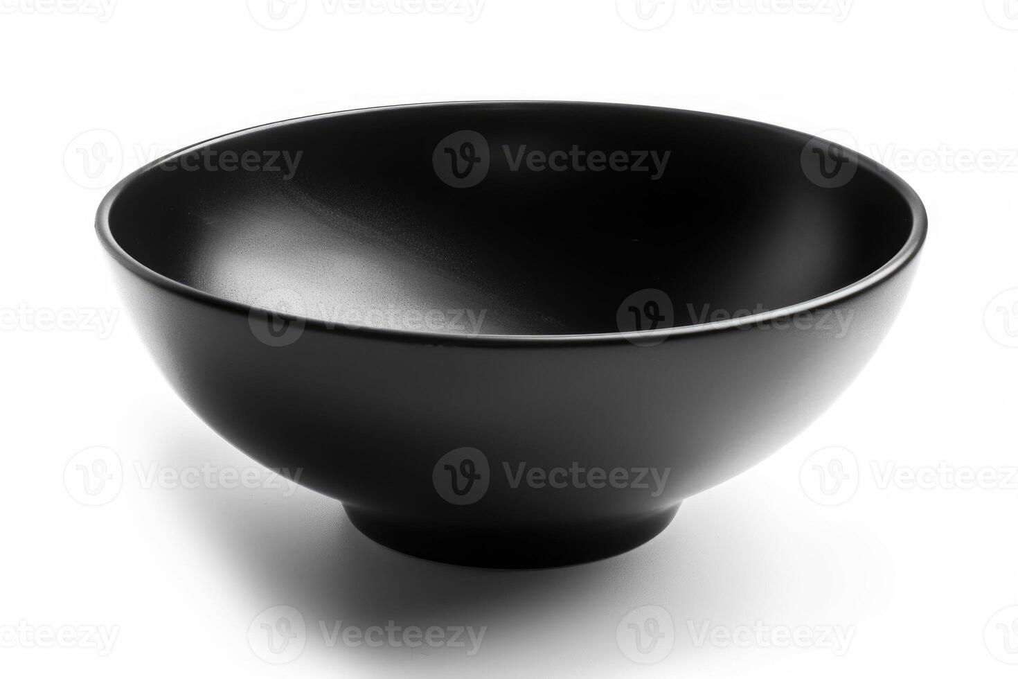 A black ceramic bowl isolated on a white background. photo