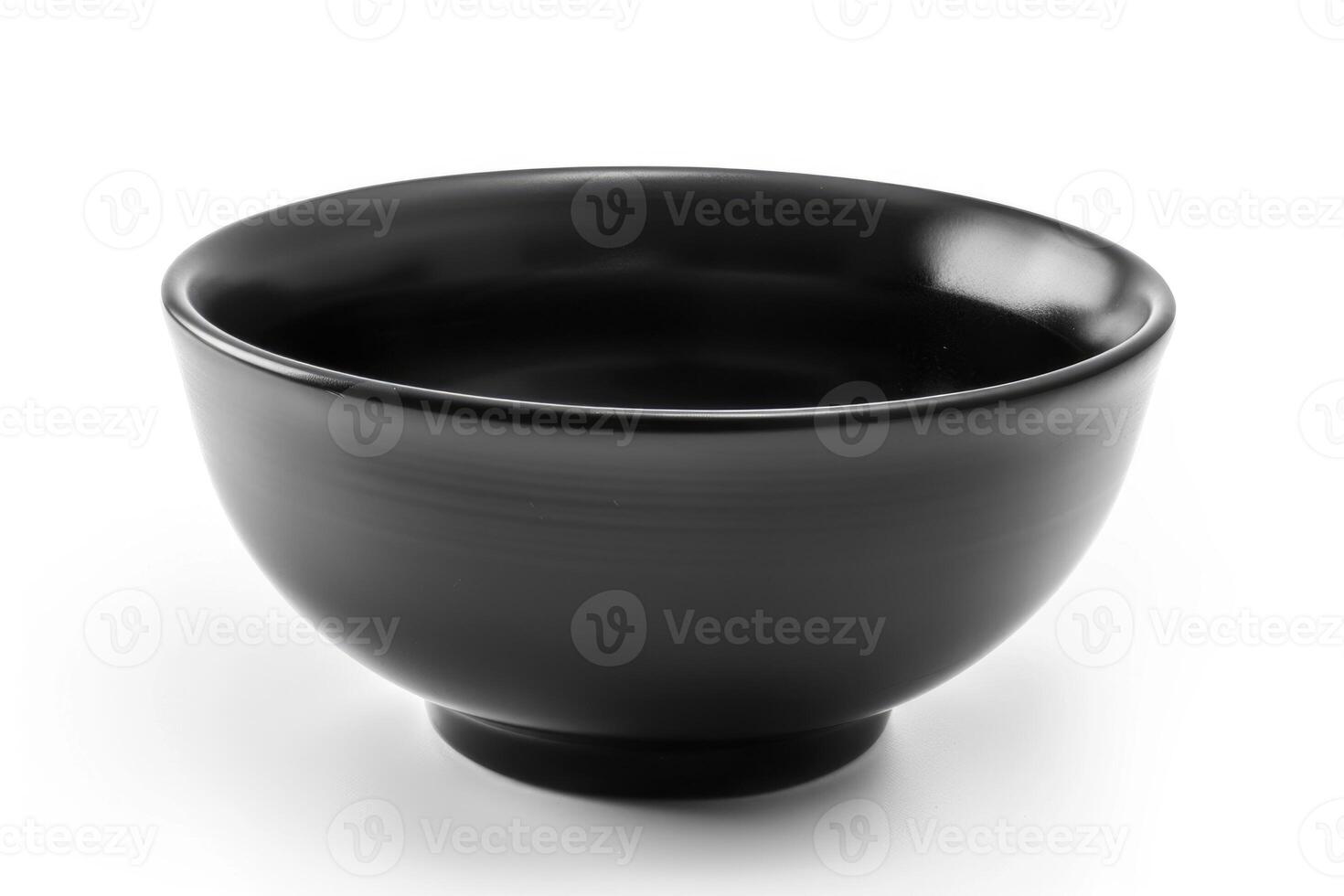 A black ceramic bowl isolated on a white background. photo