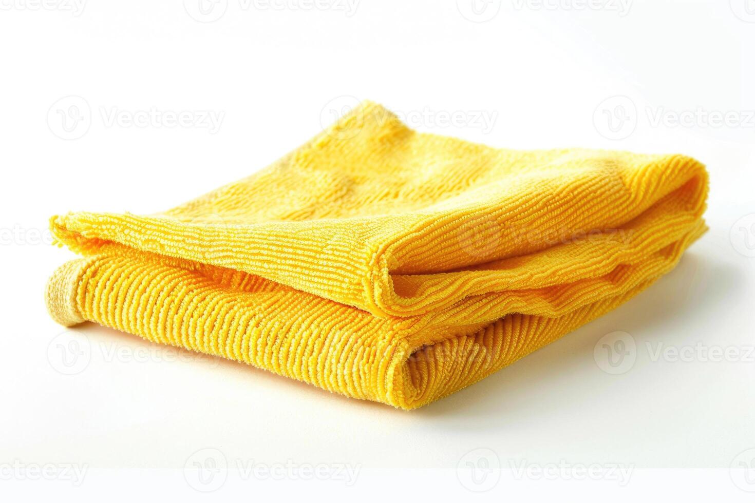 A yellow microfiber cleaning cloth isolated on a white background. photo