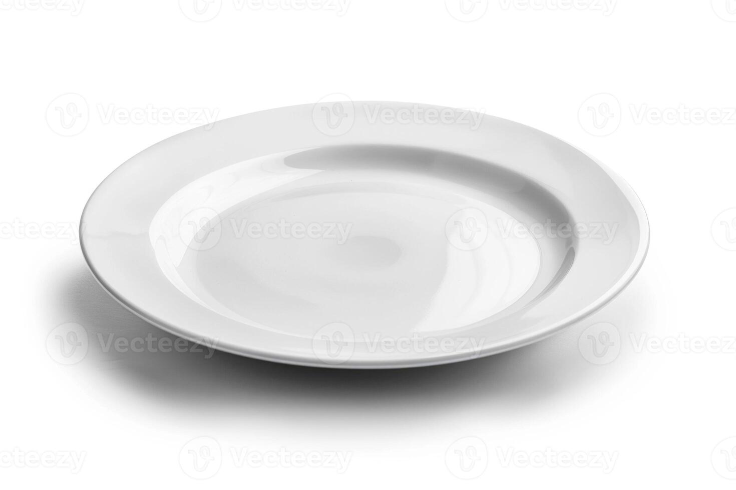A white ceramic plate isolated on a white background. photo