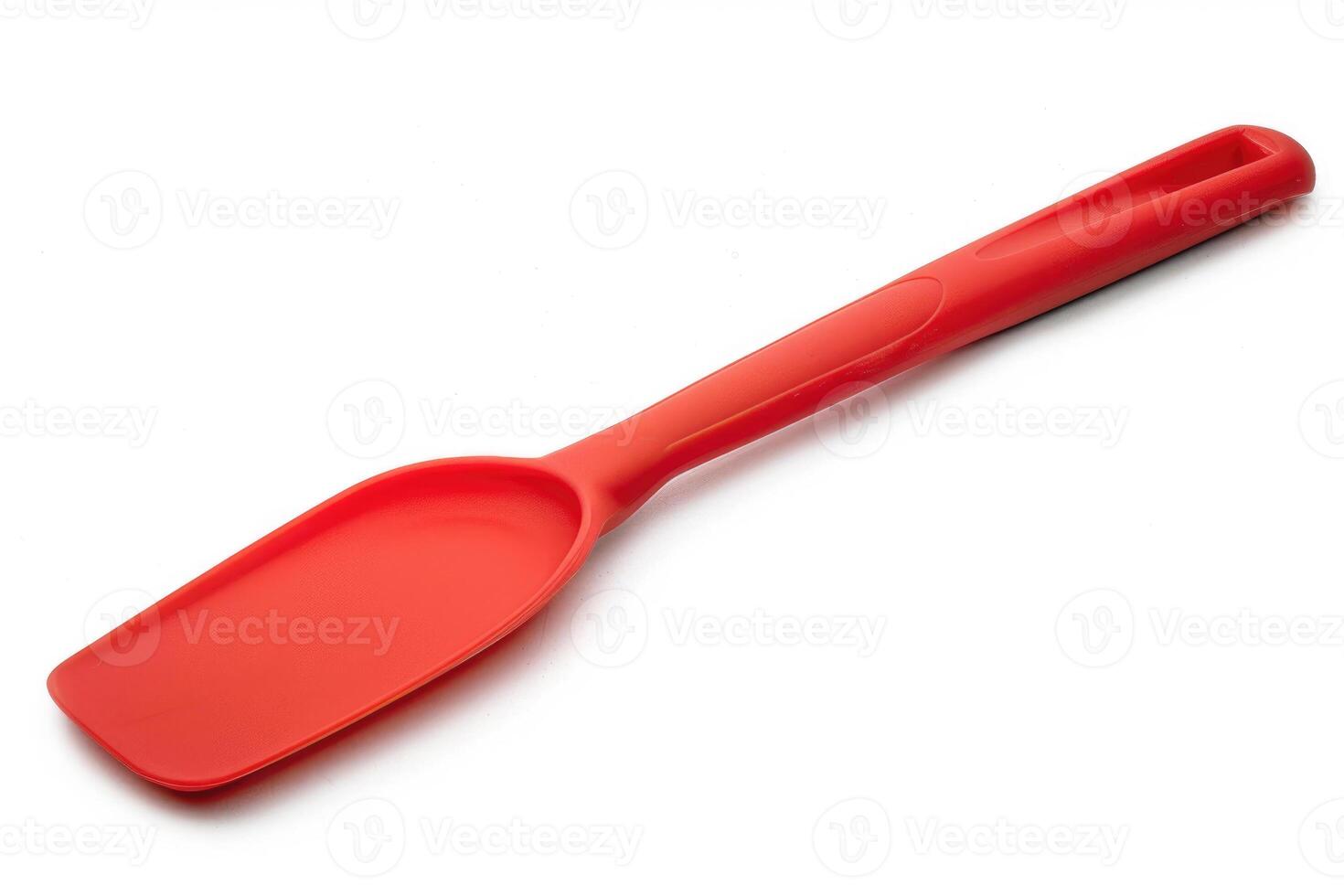 Red silicone spatula on a white background. photo