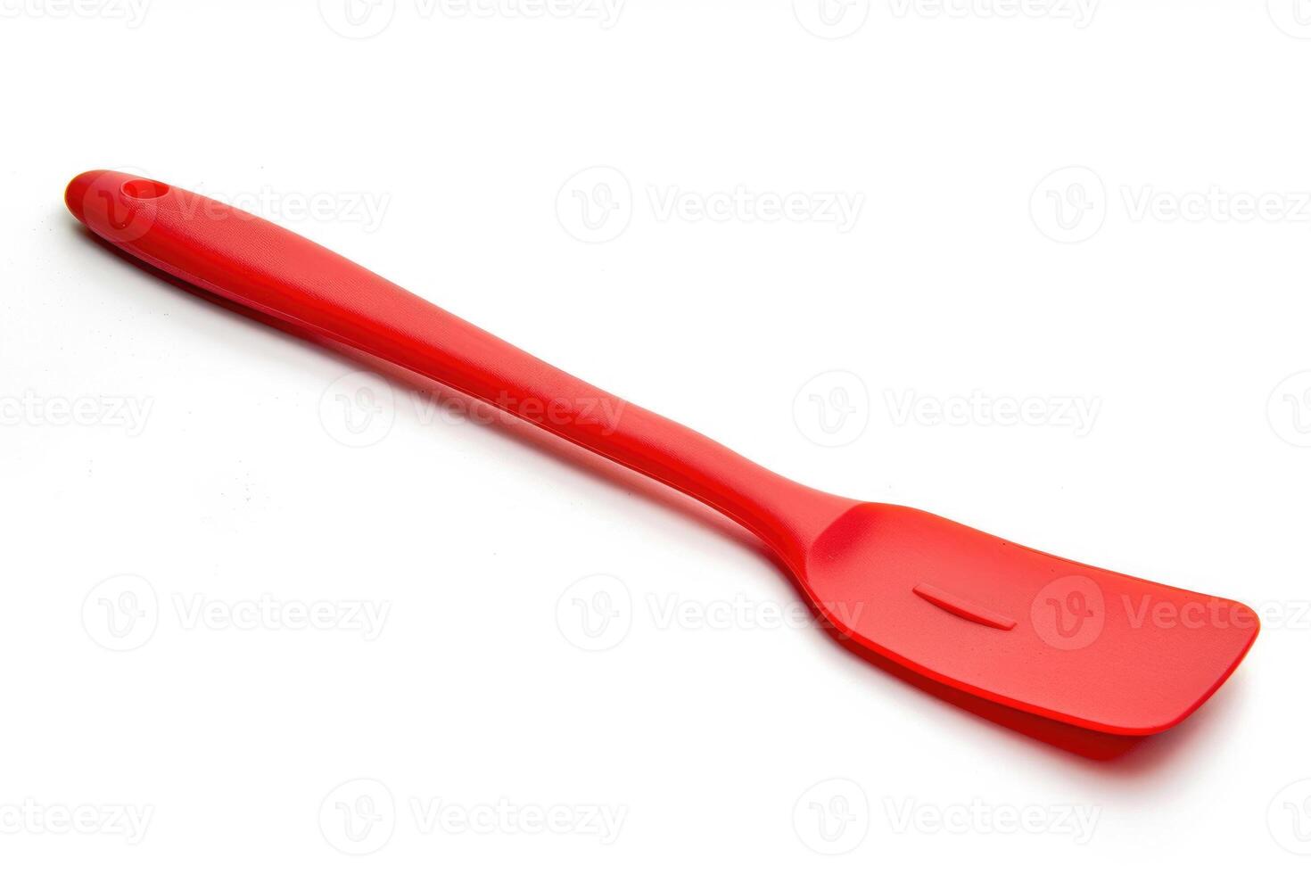 Red silicone spatula on a white background. photo
