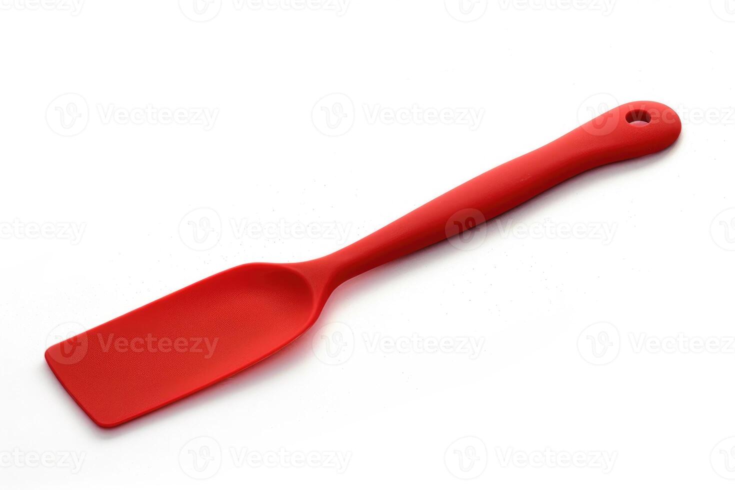 Red silicone spatula on a white background. photo