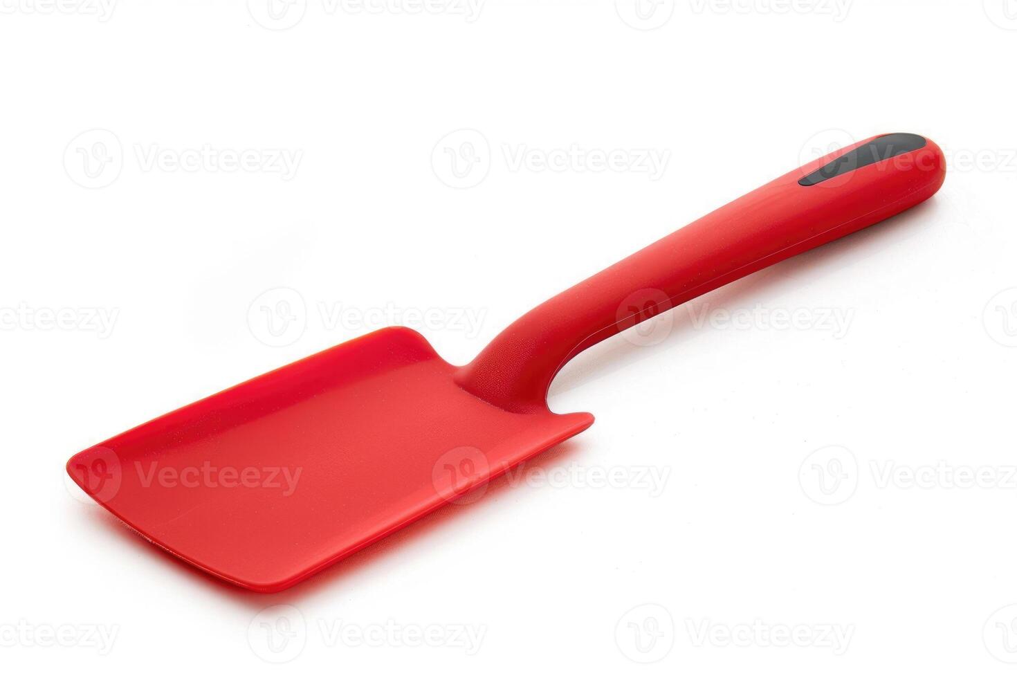 Red silicone spatula on a white background. photo