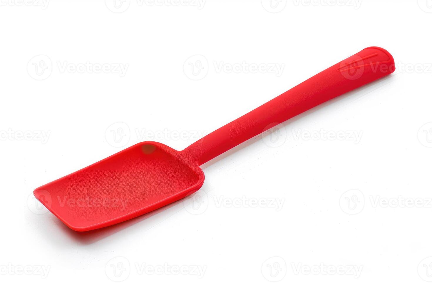 Red silicone spatula on a white background. photo