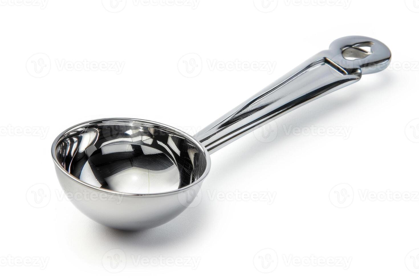 Stainless steel ice cream scoop on a white background. photo