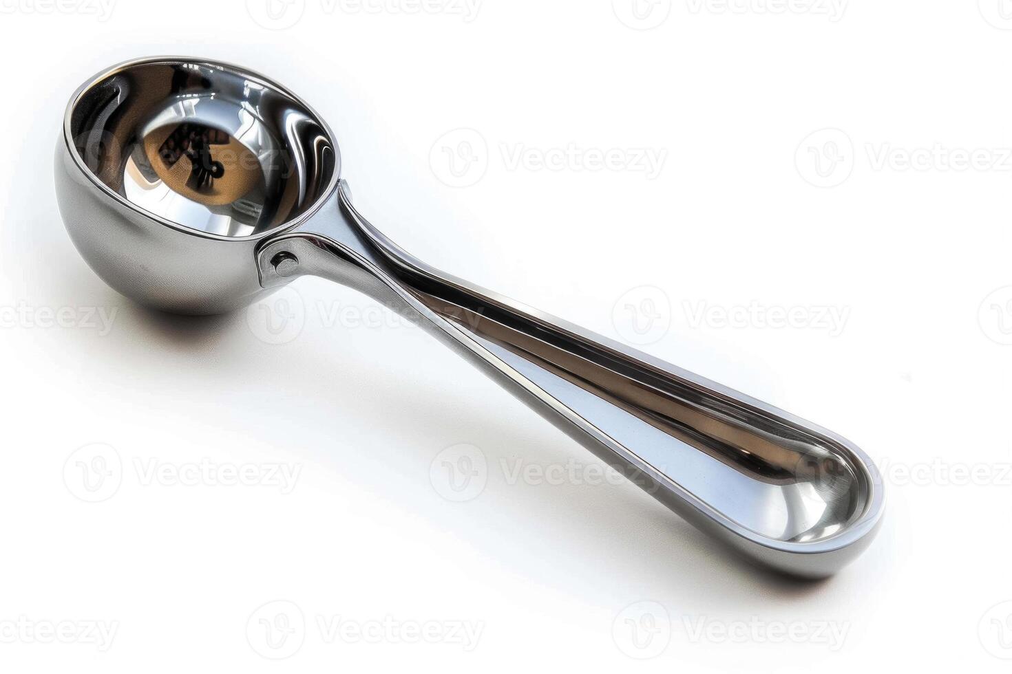 Stainless steel ice cream scoop on a white background. photo