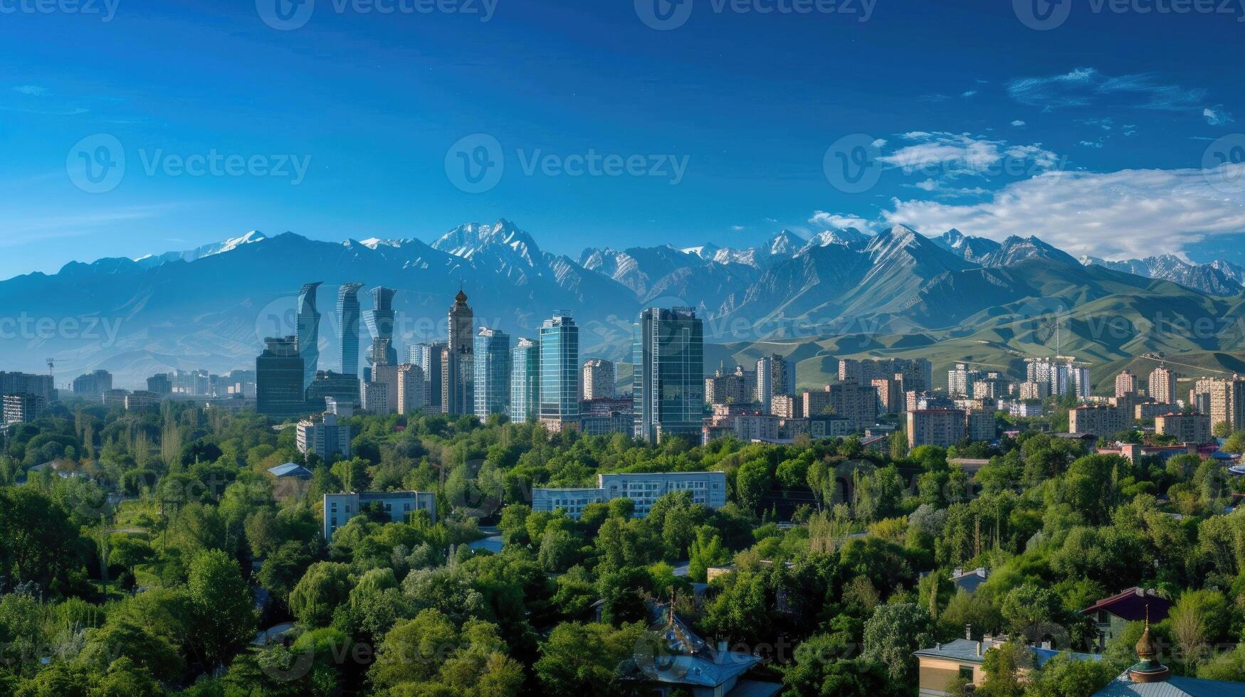 A panoramic view of Almaty's skyline with the majestic mountains in the background. photo