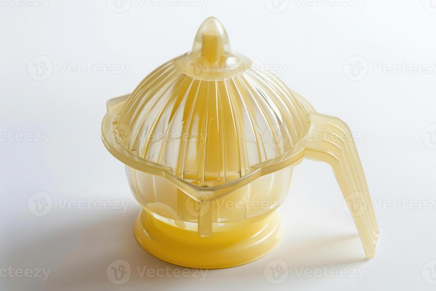 Plastic citrus juicer on a white background. photo
