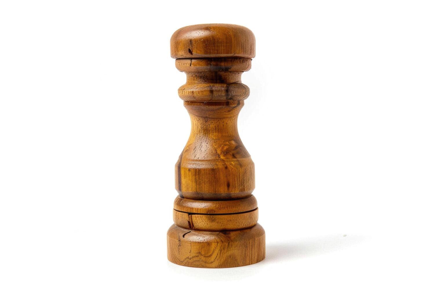 Wooden pepper mill on a white background. photo