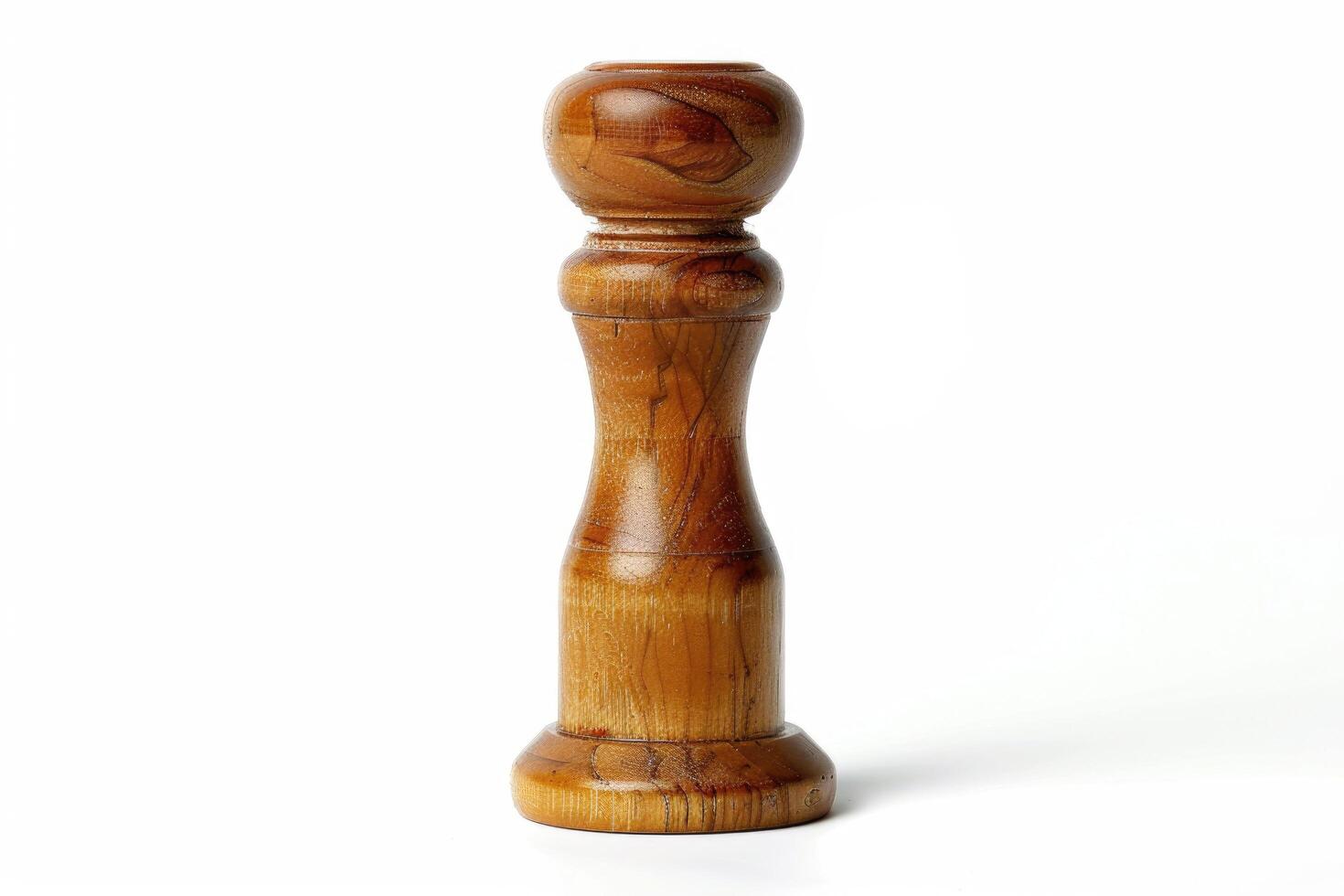 Wooden pepper mill on a white background. photo