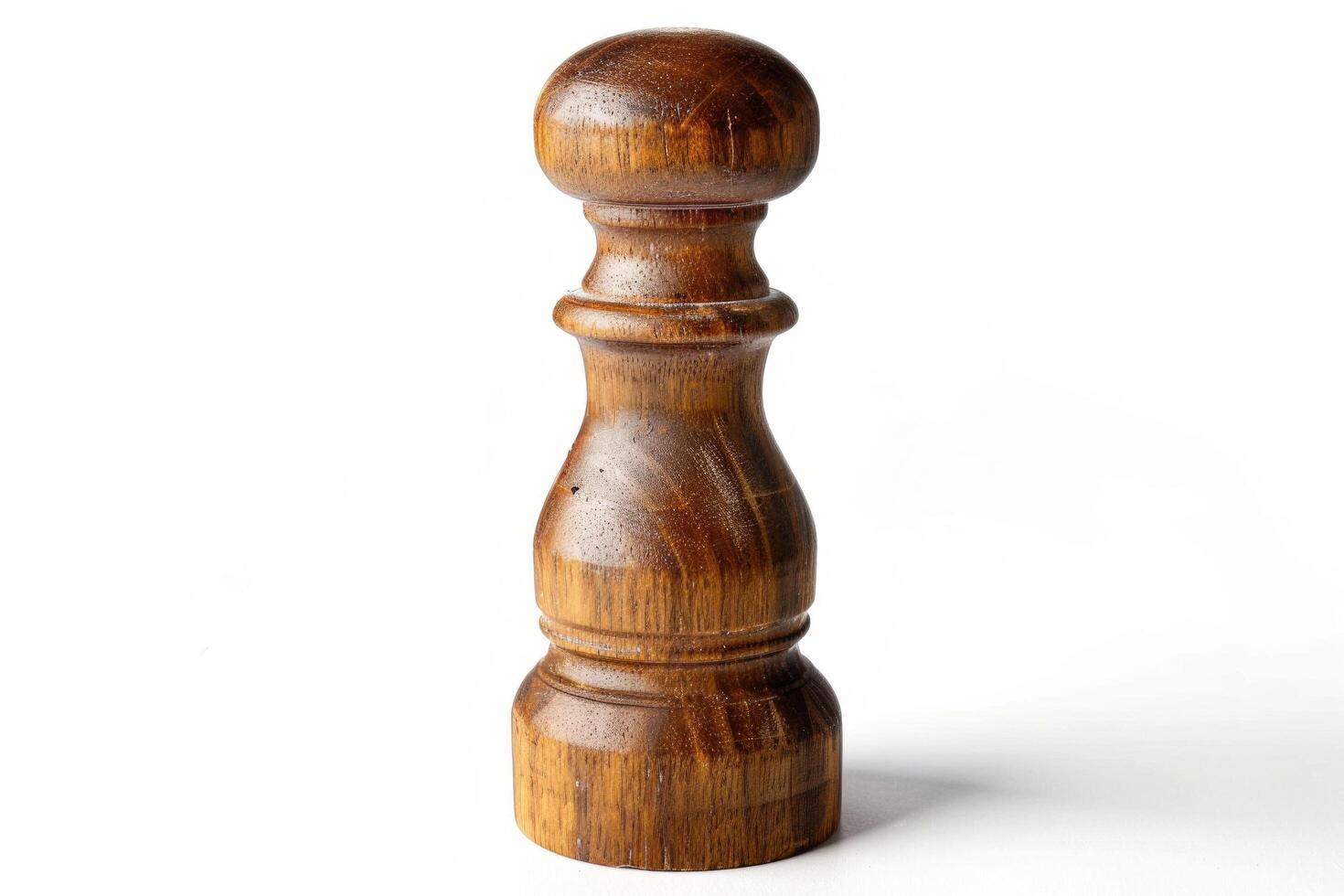 Wooden pepper mill on a white background. photo