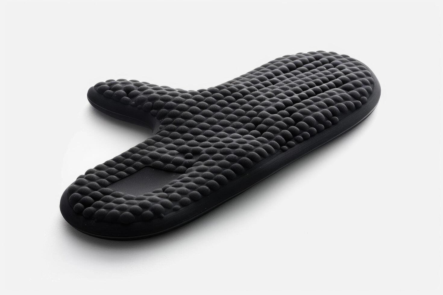 Black silicone oven mitt on a white background. photo
