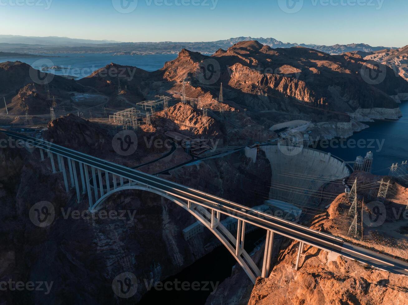 Hoover Dam on the Colorado River straddling Nevada and Arizona at dawn from above. photo
