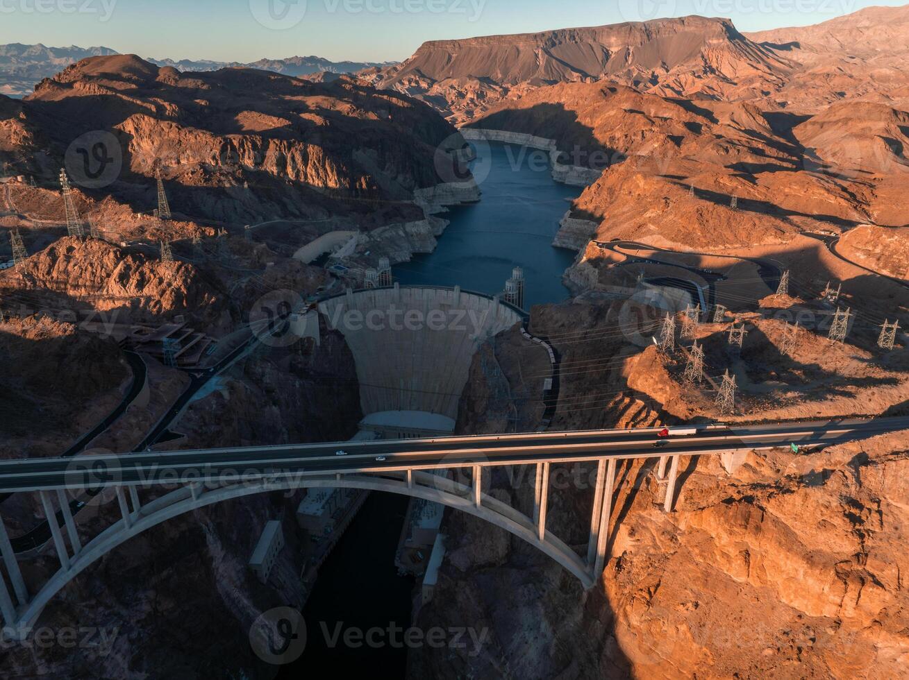 Hoover Dam on the Colorado River straddling Nevada and Arizona at dawn from above. photo