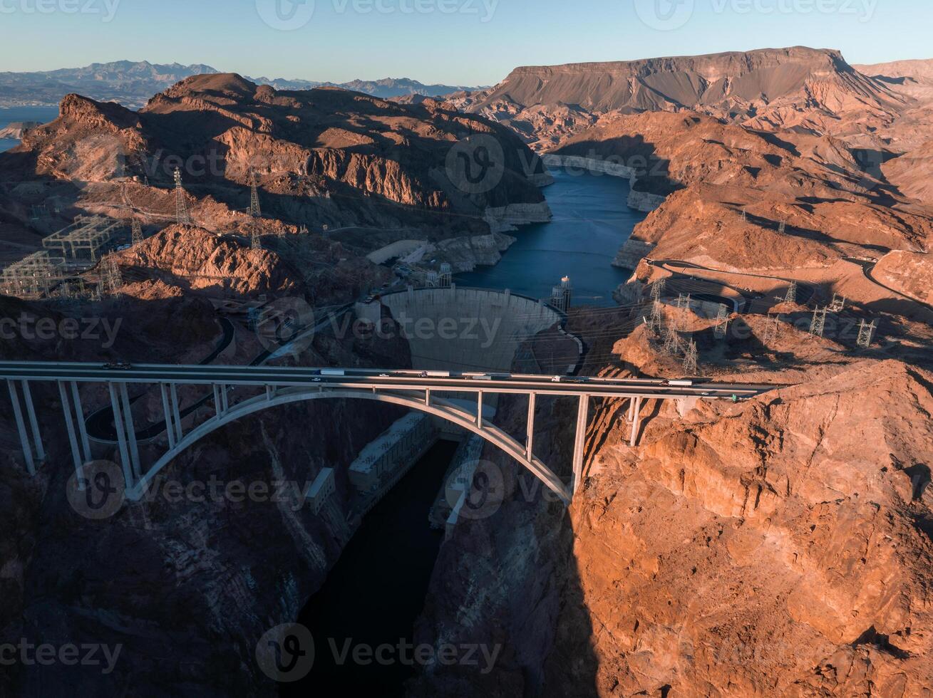 Hoover Dam on the Colorado River straddling Nevada and Arizona at dawn from above. photo