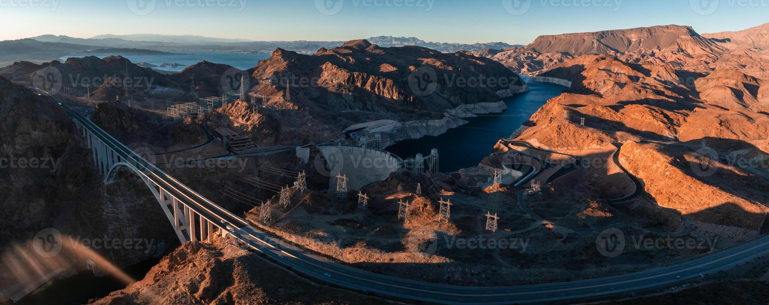 Hoover Dam on the Colorado River straddling Nevada and Arizona at dawn from above. photo