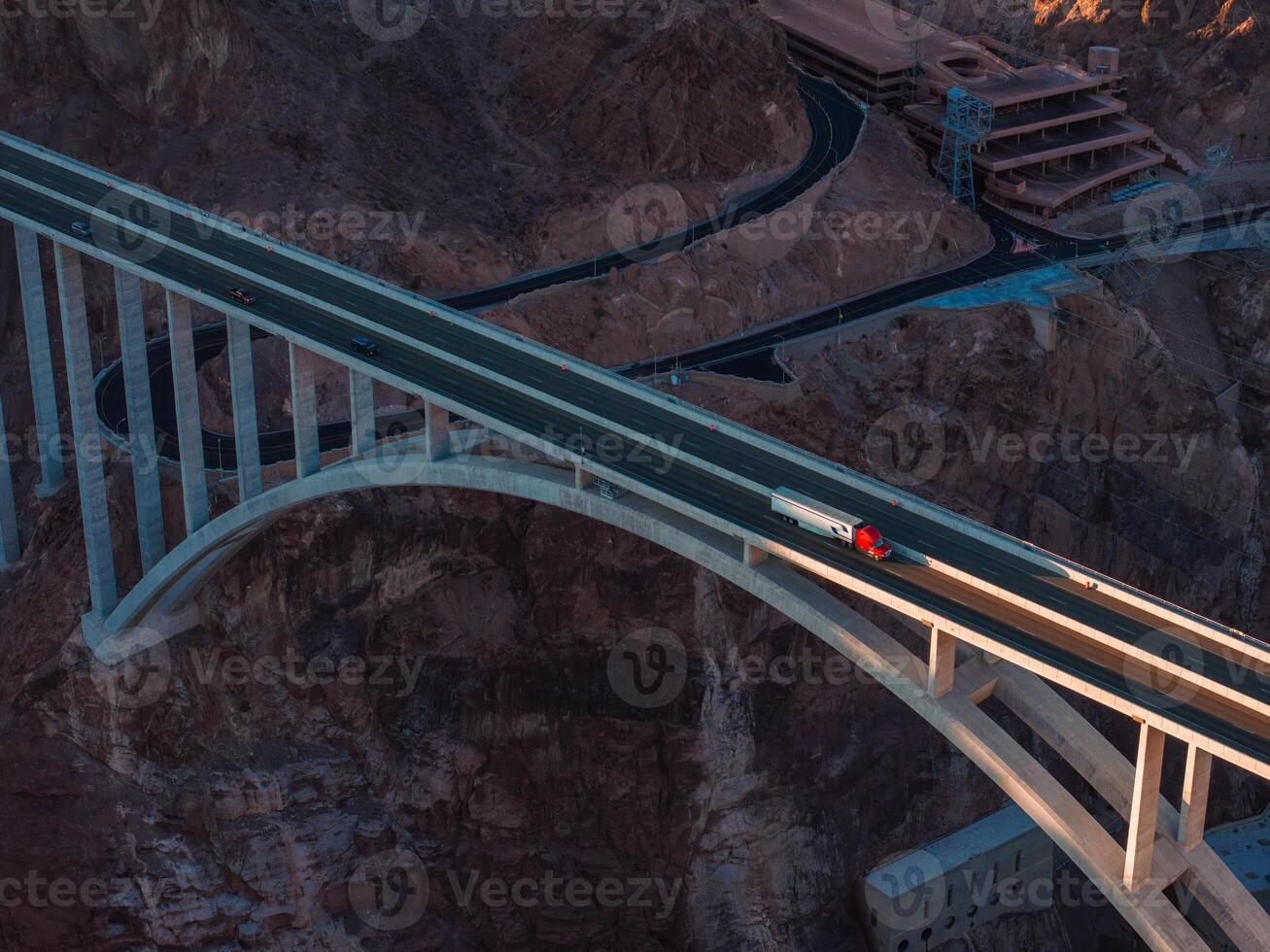 Hoover Dam on the Colorado River straddling Nevada and Arizona at dawn from above. photo