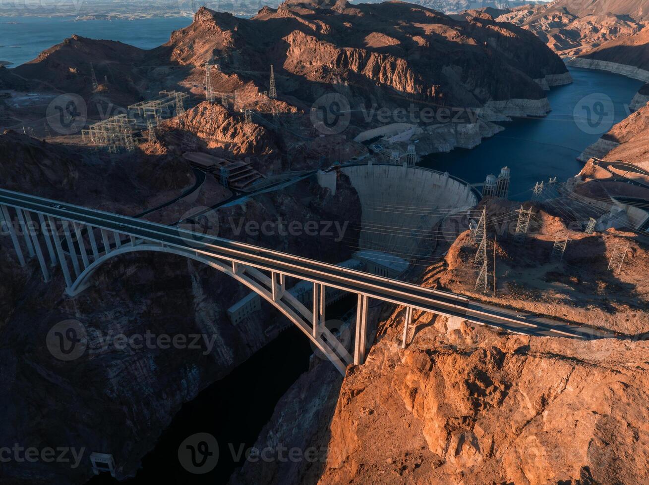Hoover Dam on the Colorado River straddling Nevada and Arizona at dawn from above. photo